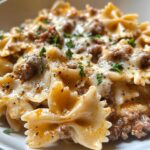 Cheesy Bowtie Pasta with Savory Cajun Ground Beef in Garlic Cream