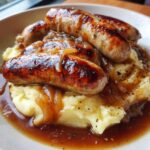 Classic British Sausages with Creamy Mash and Rich Onion Gravy