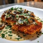 Golden crispy chicken with parmesan mushroom sauce