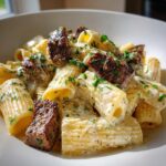 Rigatoni in Garlic Butter Parmesan Cream Sauce with Cajun Steak Tips