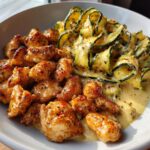 Garlic Chili Oil Chicken Bites Cajun Alfredo with Charred Zucchini Twists.