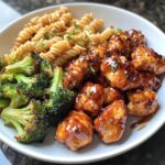 hot honey garlic chicken bites with Cajun Alfredo and crispy broccoli twists