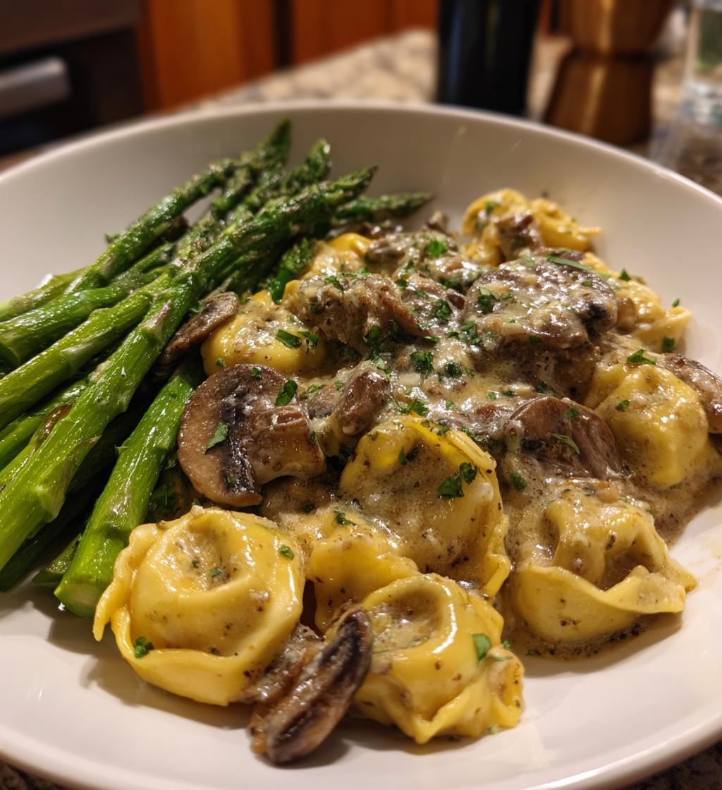 Beef Tortellini with Cheese and creamy mushroom sauce served with buttered asparagus