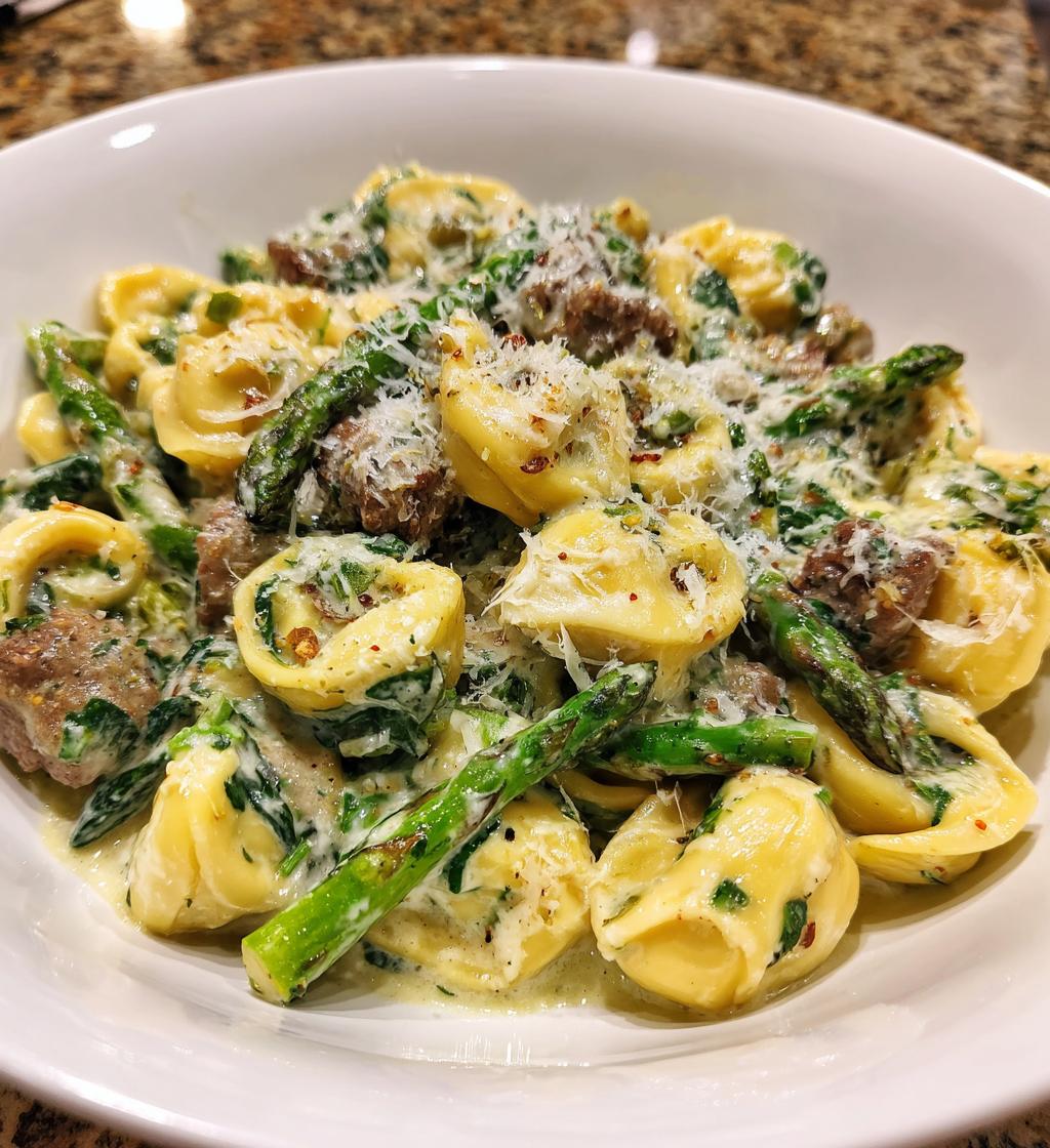 Beef Tortellini with Cheese and spinach cream sauce with asparagus tips