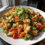 Cauliflower “fried rice” stir-fry packed with colorful veggies and lean protein.