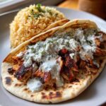 Delicious Greek Chicken Gyros with Homemade Creamy Tzatziki Sauce and rice pilaf