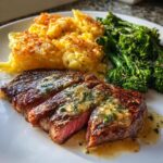 Garlic Butter Steak and Cheddar Cheese Potatoes with steamed broccoli and pepper sauce