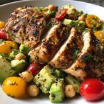 Greek-yogurt marinated chicken served over a fresh avocado-chickpea salad.