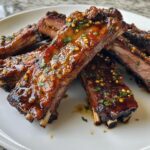 Moroccan Spiced Lamb Ribs with Aromatic Garlic Harissa Glaze