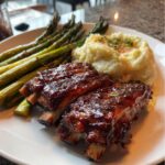 Tender Oven-Baked Ribs with mashed potatoes and roasted asparagus